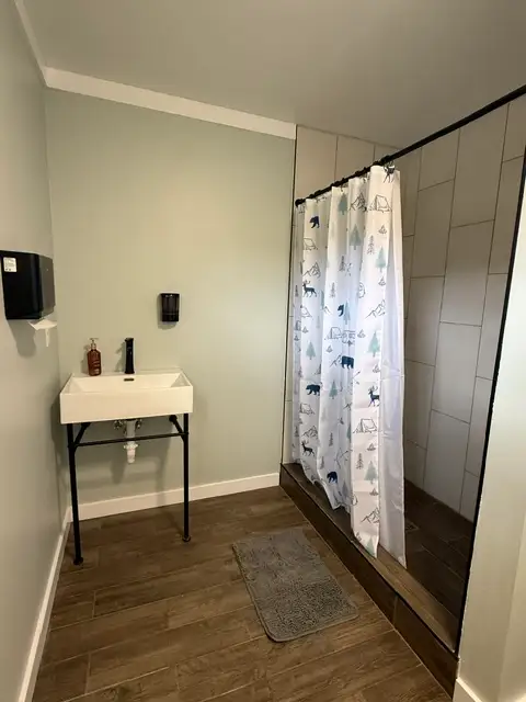 Private Bathhouse – tiled shower, sink, toilet